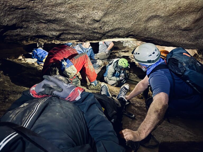 Teams work shoulder to shoulder inside the cave